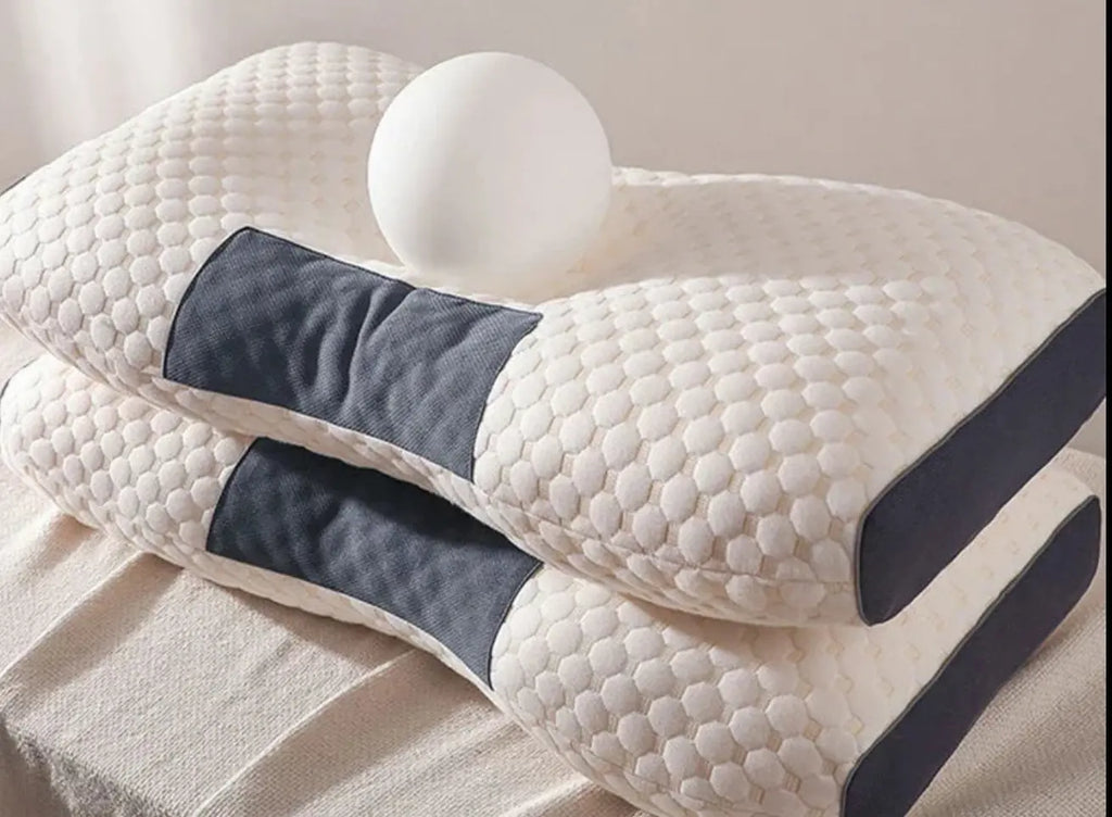 Pila de dos almohadas cervicales ergonómicas de fibra de soja con textura de panal blanca y laterales de malla gris, mostrando la altura y el diseño